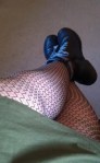 Olive dress, fishnets (legs)